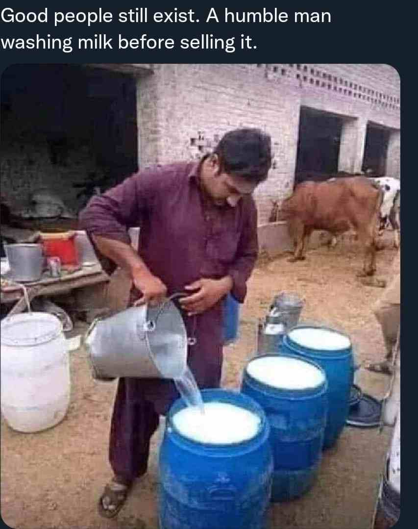 Good People still exist A humble man washing milk before selling it